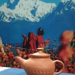 Terracotta teapot with cup