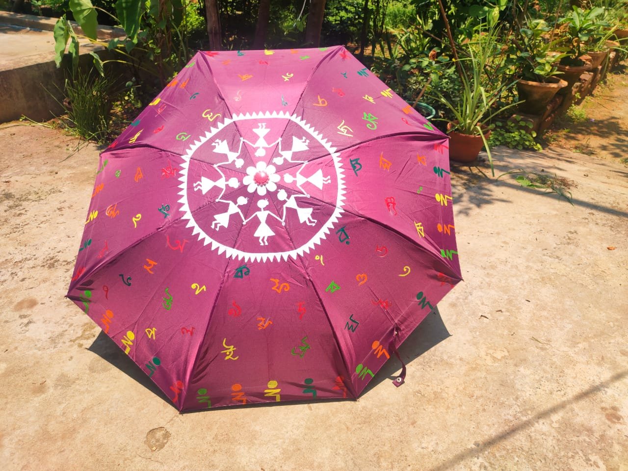 warli painting on umbrella shape